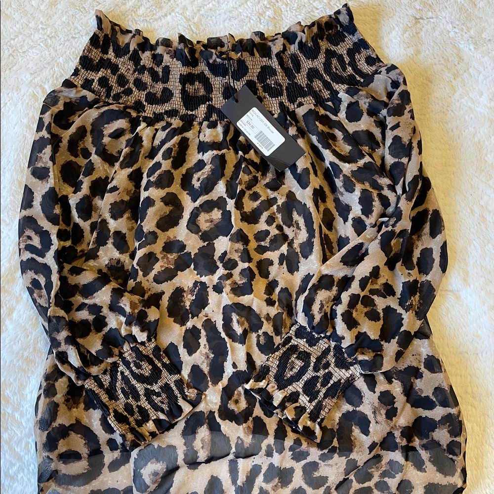 Perfect for rodeo! Women’s off shoulder leopard top- anything bling boutiqueNWT.